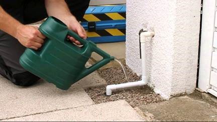 water being poured over pipe