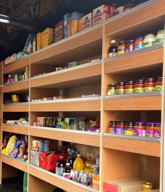 Inside of mobile food hub with stocked shelves