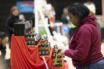 Woman browses a stall at SCDC Christmas Market